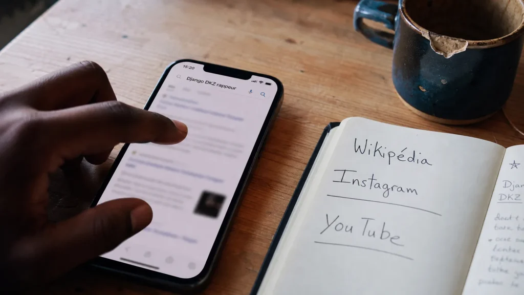 django rappeur Django DKZ : preuves Wikipédia, Instagram et YouTube sur smartphone
